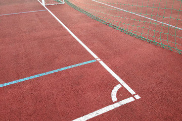 Close-up of white marking lines of outdoor basketball court.
