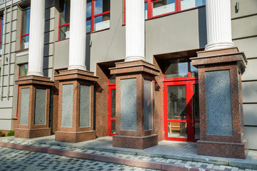 Detail of a house facade. Granite columns as decorative elements of the building.