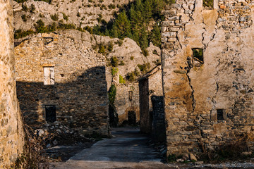 Streets of an abandoned and ruined village located in the mountains.