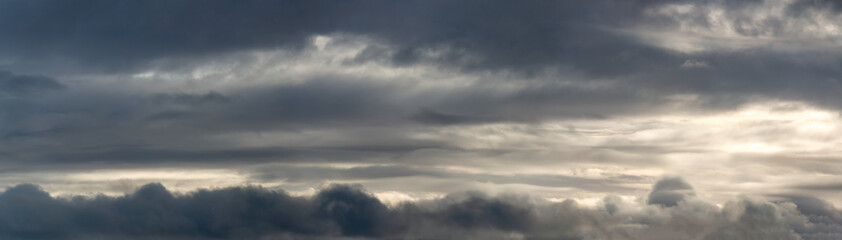 Obraz premium Fantastic dark thunderclouds at sunrise