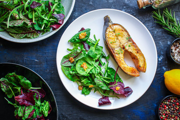 pink salmon steak fried and salad, grilled seafood, pescatarian Menu concept food background keto or paleo diet. top view. copy space for text