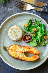 pink salmon steak fried and salad, grilled seafood, pescatarian Menu concept food background keto or paleo diet. top view. copy space for text