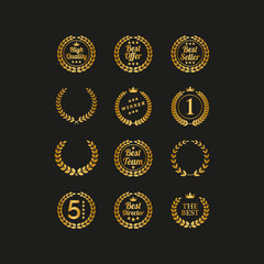 Set of golden laurel wreaths on black background.