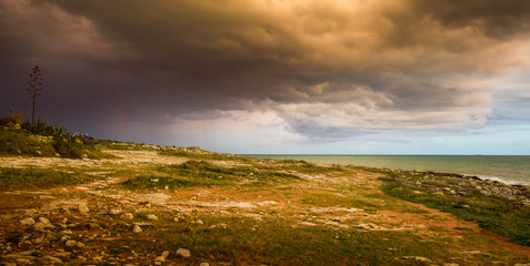 Sicily sunset at cloudy sea with arrival of a storm