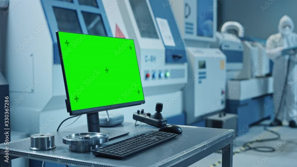 Fototapete factory cleanroom: on the desk personal computer showing green screen chroma key display. in backgro