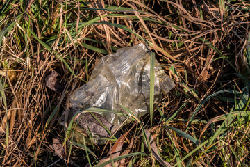 Plastic waste thrown away in the middle of nature