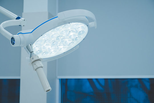 surgical lamps in operation room take with art lighting and blue filter. lighting fixture in a hospital operating room. Coronavirus, virus, operating room, laboratory