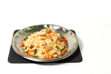 a plate of homemade fried rice recipe with vegetable slice isolated on white background