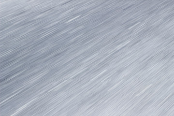 Background of a gray blurred asphalt road, close- up