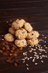 cookies with raisins and seeds on a brown background