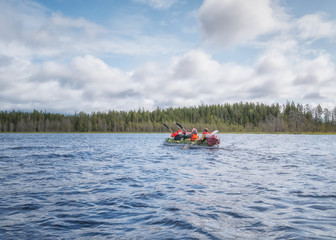 Landscape of harsh Karelian nature. A family in boat. Active extreme holidays in Karelia. Water...