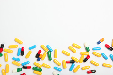 pills on a light background top view. Medicine, treatment, illness. Medication in tablets.