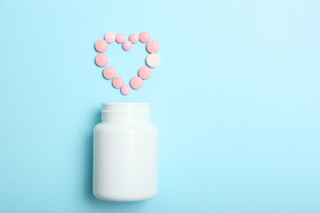 pills on a colored background top view. Medicine, treatment, illness. Medication in tablets.