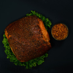 Roasted Turkey Breast Cajun Style Deli Lunch Meat on Black Background. Selective focus.