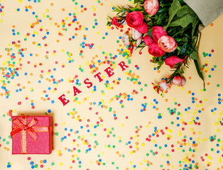 Festive Easter card with a bouquet of roses and a red box