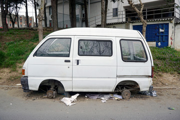 Fototapeta na wymiar A wreck junk car in the street