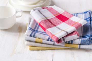 Kitchen towels stack on wooden white table
