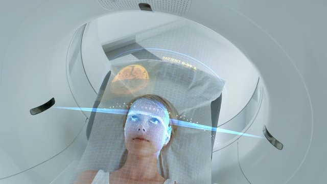 Female Patient Lying on a CT or PET or MRI Scan Bed, Moving Inside the Machine While it Scans Her Brain and Vital Parameters. AR Concept with Visual Effects In Medical Lab with High-Tech Equipment.