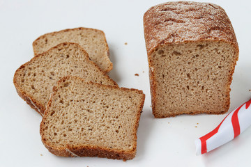 Sliced square whole grain flour bread , located on a white background