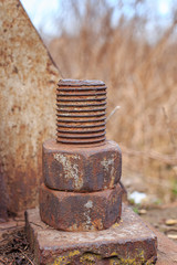 Rusty nut screwed on a rusty bolt