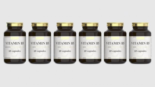 Pharmacy glass bottles with generic vitamin B5 capsules and fictional logo. Pharmaceutical industrial production related 3D animation