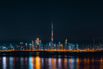 Fototapeta na wymiar Dubai Skyline Taken at Night Showing Burj Khalifa and Dubai Downtown, Reflected on Dubai Creek