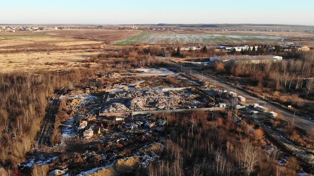 Aerial drone view of landfill site, zoom in. Heap of garbage. Theme of ecology and pollution, conservation of clean environment and nature. 