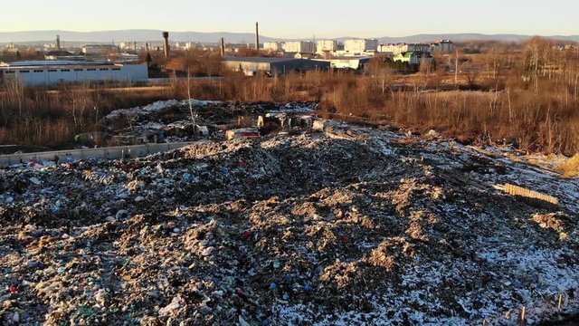 Aerial drone view of landfill site. Heap of waste. Theme of pollution and environmental threats