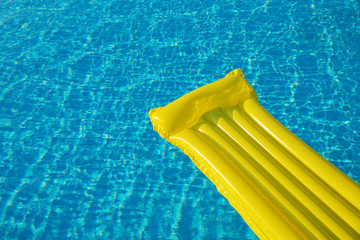 Air Yellow Mattress On The Water In The Pool