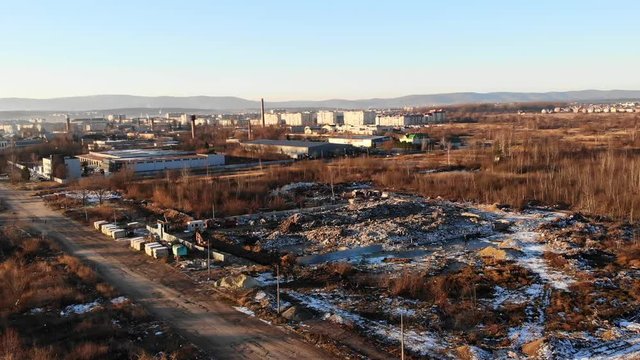 Landfill site from bird's eye view. Uncontrolled landfill is a huge environmental threat. The theme of ecology and pollution, conservation of clean environment and nature. Aerial drone view