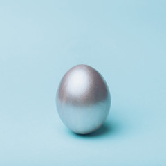Silver egg on a blue background.