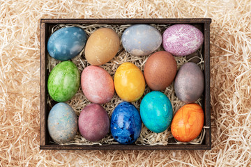 Different easter eggs with straw