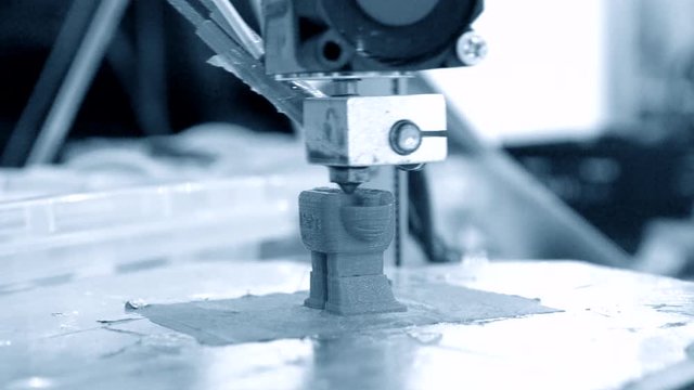 3D printer working. Fused deposition modeling, FDM. 3D printer