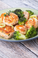 Plate of salmon meatballs with vegetables