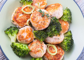 Plate of salmon meatballs with vegetables