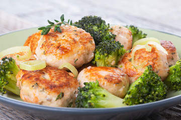 Plate of salmon meatballs with vegetables