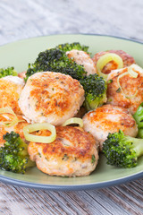 Plate of salmon meatballs with vegetables