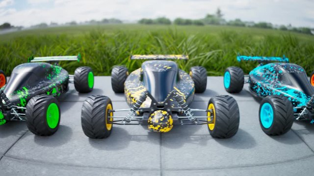 Multiple colourful remote-controlled buggy cars on a sidewalk in endless row.