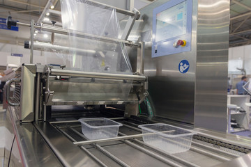Machine for packing food products close-up. Industry