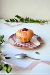 Cupcakes with cottage cheese, cherry honey and cherry on top.