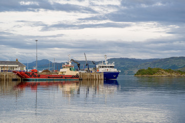 Cargo ship and ferry at Hebrides islands archipelago. Kyle of Lochalsh,Scotland