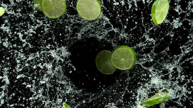 Super slow motion of rotating lime slices in water twister shape. Filmed on high speed cinema camera, 1000 fps.
