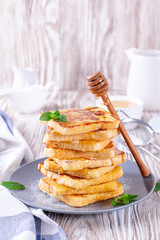 French toast with honey on a plate