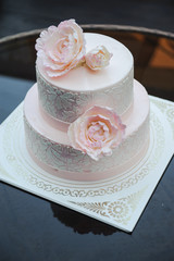 Luxurious pink wedding cake with flowers. Birthday, Valentine's day cake