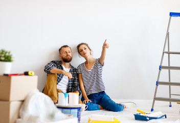 Young couple planning room interior
