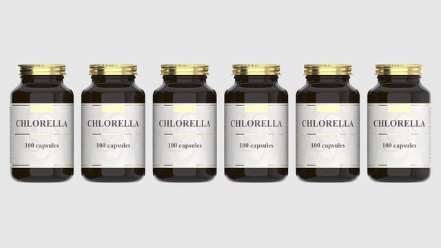 Medicine glass bottles with generic chlorella capsules and fictional logo. Pharmaceutical industrial production related 3D animation
