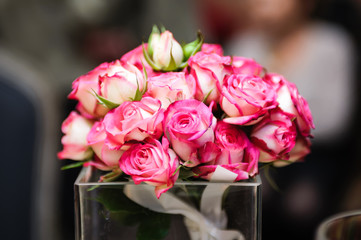 Colorful wedding bouquet on a restaurant served table. Bridal bouquet. Luxury royal restaurant. Valentine's day, birthday, dating or mother's day decoration