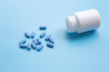 PrEP ( Pre-Exposure Prophylaxis) used to prevent HIV, on blue background.