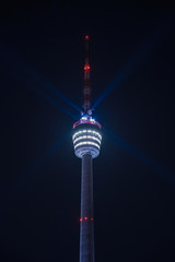 Stuttgart Television Tower (Fernsehturm) against night sky with stars and light beams, Germany © Timo Günthner