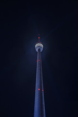 Extreme perspective of Stuttgart Television Tower (Fernsehturm) against night sky with stars and...